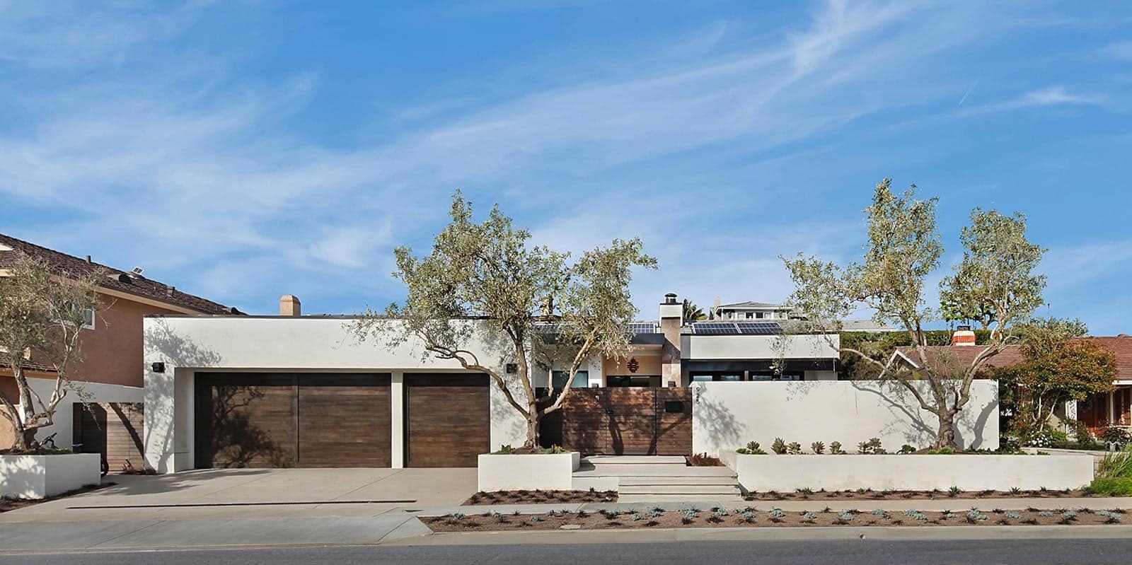 Wood-look garage door on a coastal home